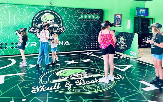 Group of five children enjoying immersive VR experience at Skull & Books VR in Cocoa Beach