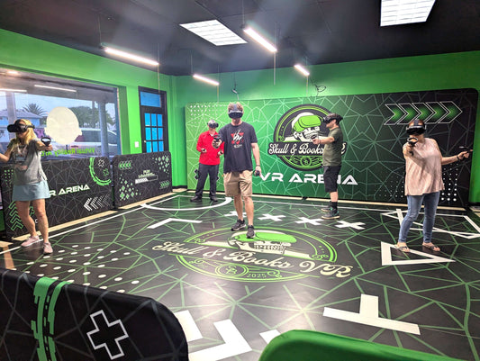 Group of five adults enjoying immersive virtual reality arcade at Skull & Books VR in Cocoa Beach